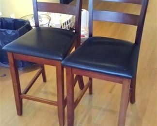 pair of bar stools and matching table