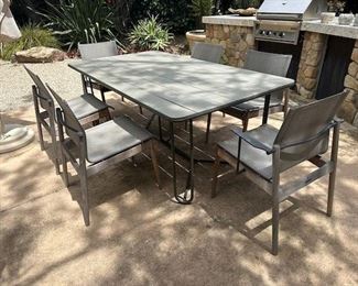 $1,900. Gloster teak dining table 77 x 43. Gloster chairs 4, armchairs 2.