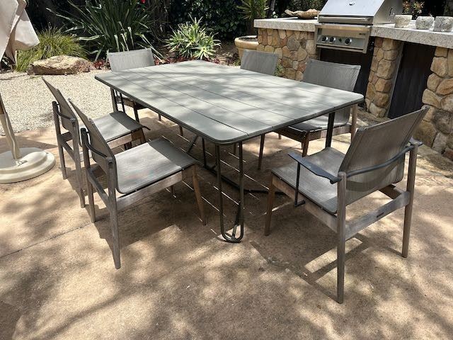 $1,900. Gloster teak dining table 77 x 43. Gloster chairs 4, armchairs 2.