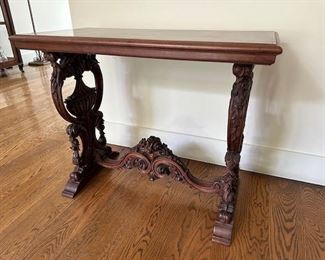 $275 each. Two neo-classical side tables- different cross stretcher carvings.