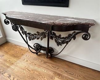 $3000. French wrought-iron console table. A very stylish table re-interpreting late 18th century designs and looking forward to the modernist theatricality of Art Deco. 67.5 x 18 x 38