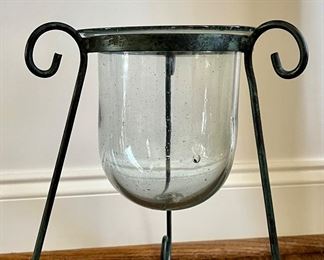 Glass candle holder on metal stand