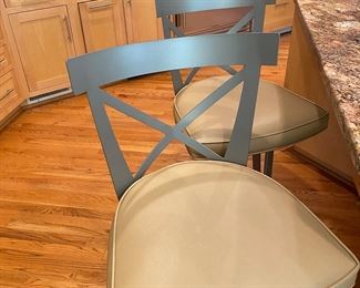 Two of four Johnston Casual steel and leather counter chairs/bar stools
