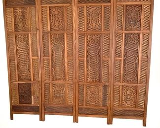 South East Asian wood screen mounted on wall