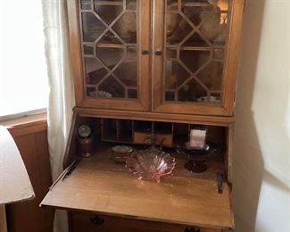 Vintage secretary with glass cabinet.  Vintage colored glass bowls and vases sold separately.
