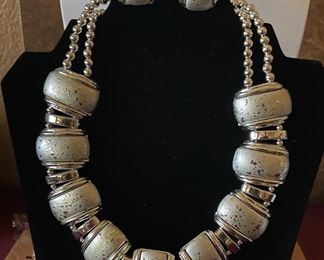 Set of silver tone necklace and matching earrings