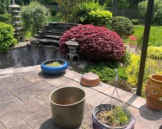 Many outdoor planters and garden fixtures