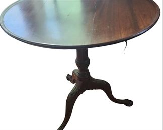 A Period  Tilt-Top, claw foot table hand forged brace 28 inches round by 29 inches, crack in the wood on tabletop