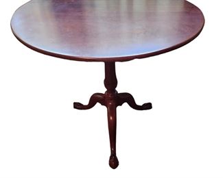 A Period Tilt Top claw foot table with hand-forged brace