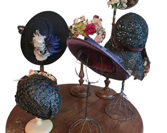Antique ladies' hats and stands 