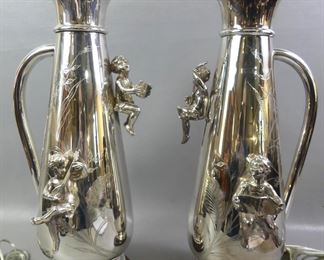 Pair silver plated lamps with cherubs