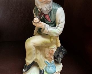Old Man with Pipe Sitting on Tree Stump Ceramic Figurine