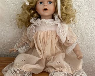 Sitting Porcelain Doll in White and Pink Dress