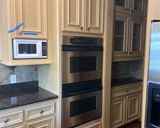 No  microwave.    All kitchen fab cabinets incl lazy Susan, doors, hardware, disposal sink stove gas, stove hood 