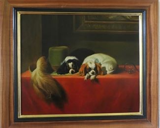 Two King Charles Spaniels napping of their master's hat.