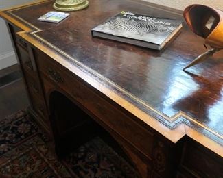 Unusual front shape of this comfortable and roomy desk.