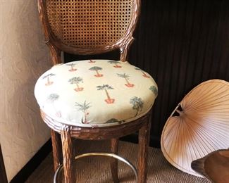 One bar stool with cane back