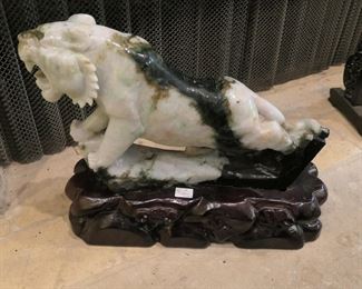 Large hard stone tiger on carved, fitted stand.