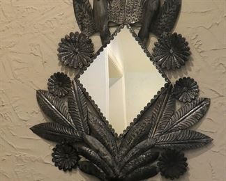 Large tin mirror from Mexico with bird and flower design.