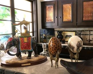 Hand painted ostrich eggs and elephant figure.