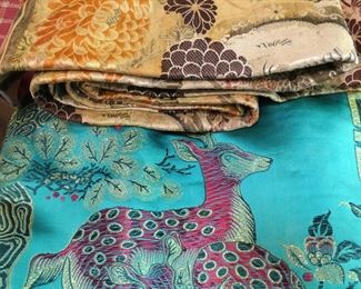 Shown in background: Obi. Foreground is a bed covering.