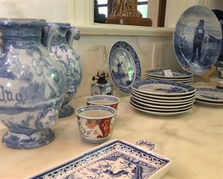 Antique blue and white Delft vases or jugs. Royal Delft plates shown in background. Portuguese blue and white bread or cake plate, two Imari tea cups.