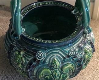 Unusual Majolica style planter with turtles and oversized upright handles.