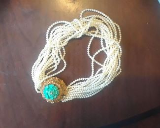 14k, Carved turquoise and multiple strands of tiny pearls make up this striking necklace that fits snugly as a choker on most throats.