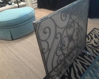 Heavy wrought iron fire screen. Hassock in background is not available.