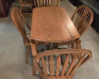 TWO SETS FOR OAK KITCHEN/DINING TABLE AND FOUR CHAIRS $75 EACH
