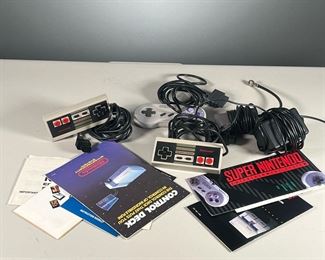 GROUP OF NINTENDO ACCESSORIES | Includes two NES controllers, an SNES controller, TV & power adapters, and instructional booklets.