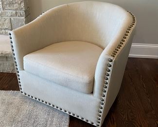 Pottery Barn swivel beige chair w/nail heads, 31"W x 35"D x 28"H,  (Retails $699),  $399