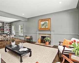 Custom table and chairs, coffee table, artwork, houseplants, pottery, area rug