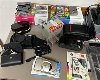 Lots of cameras-Canon, Pentax, Lumix, Nikon, Olympus