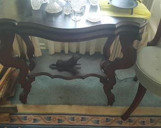 ANTIQUE TABLE DOG ON SHELF IS PART OF THE TABLE  ( NOT A STATUE SET THERE)