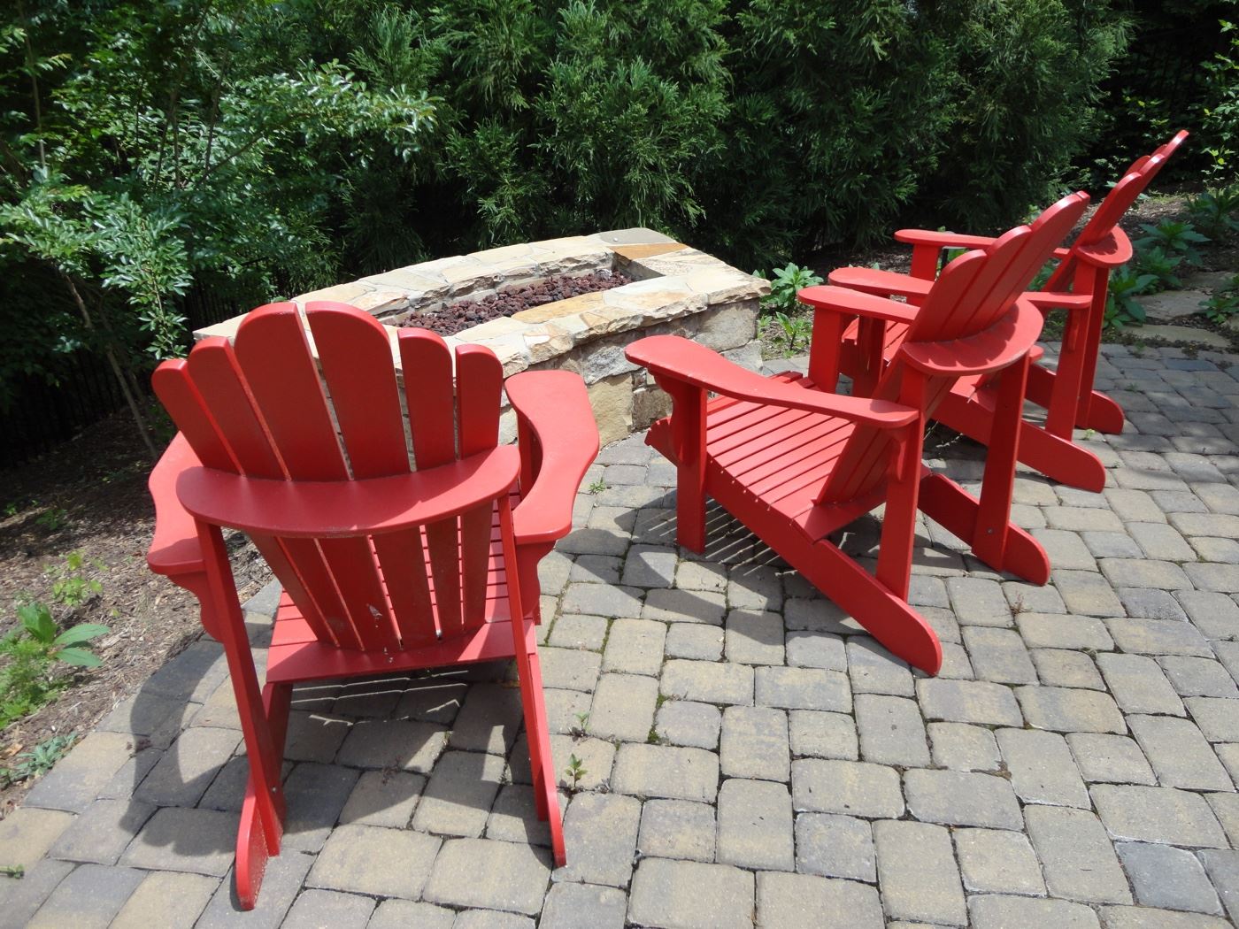 Adirondack Chairs by Leisure Line in festive Fire Red