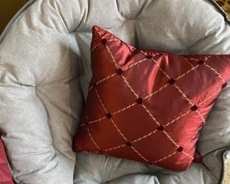 Gray round folding chair and burgundy pillow (sold separately)