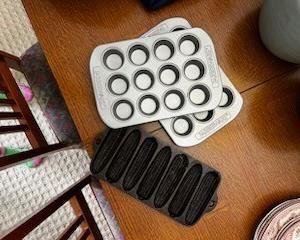Muffin pans and cast iron corn-shaped cornbread pan.