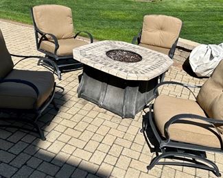 5 pc with (8) 24”x 22” Sunbrela cushions 
FIRE Table Set $595
Fire Table (no Propane tank) 46 Sq x 24”h
4 Cast Aluminum Chairs bounce/rock 26.5w x 30d x 38”h (19.5 top of cushion seat to ground)

