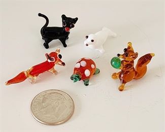 Tiny glass animals (see dime for scale)