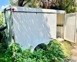 Large covered trailer. Tires need to be replaced. Inside clean!