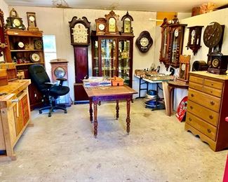 Large Clock workshop with a big assortment of vintage and antique clocks, parts, etc. 