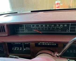 DASHBOARD OF CADILLAC SHOWING THE 75,000 MILES.  RUNS GOOD, TRANSMISSIONS SLIPS