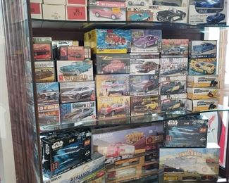 Huge assortments of models, car models, and collectible cars