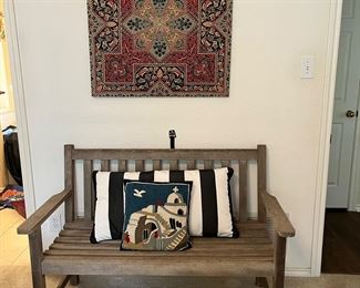 indoor/outdoor bench with decorative pillows