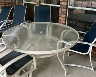 round patio table with four chairs