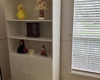 white book shelf with bottom cabinet