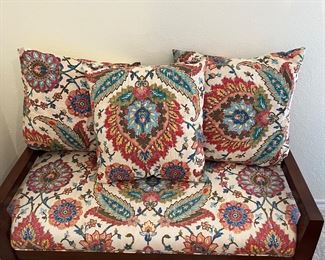 small bench with colorful pillows