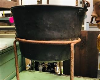 19th century cauldron on iron base