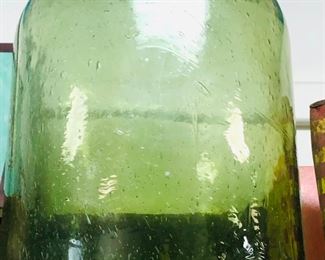 green glass large jar with bubbles throughout